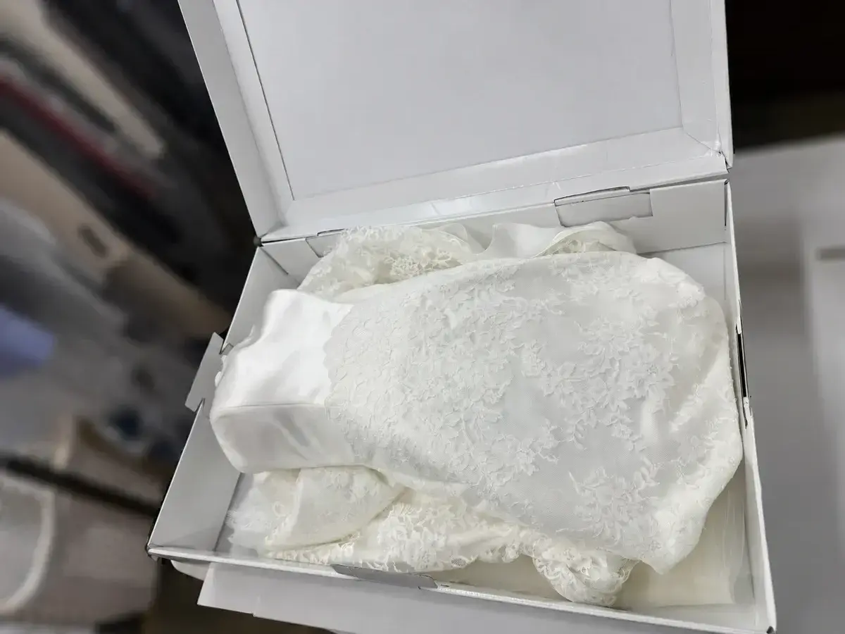 Wedding gown clean and folded in acid-free tissue inside its preservation box at Baroni Cleaners Irvine